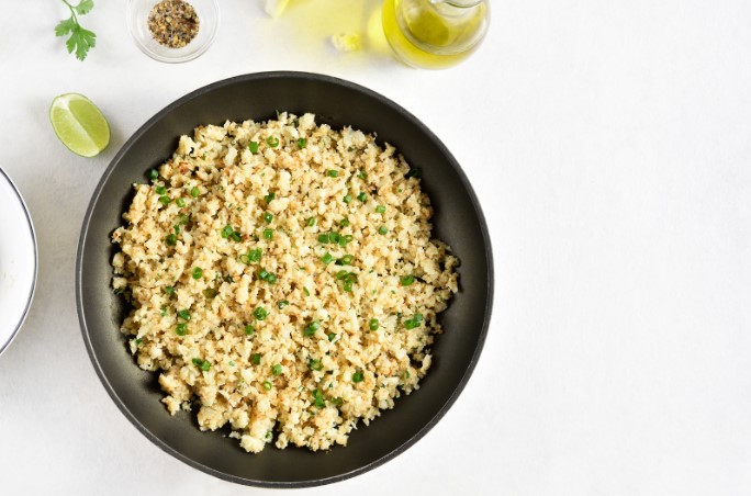 Stir-fried cauliflower with green onion garnish 