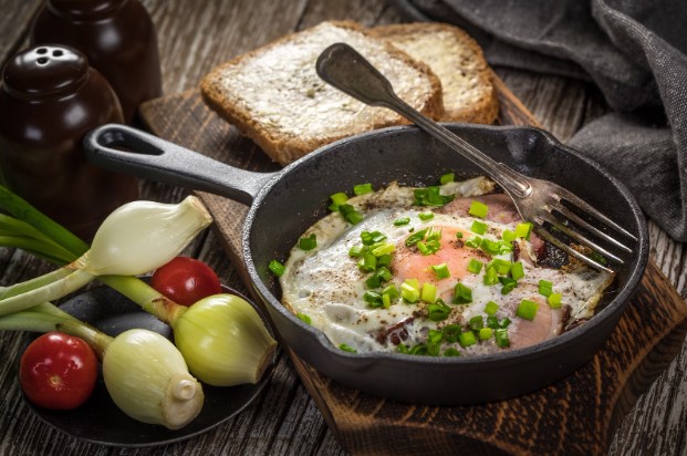 fried egg and turkey meat in a skillet