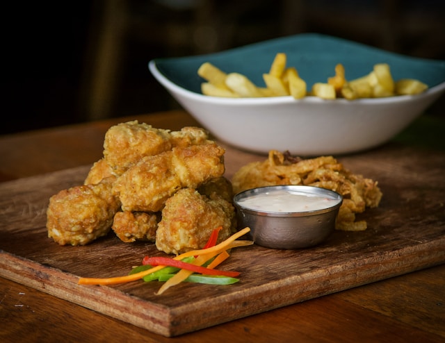 chicken nuggets on a wooden board